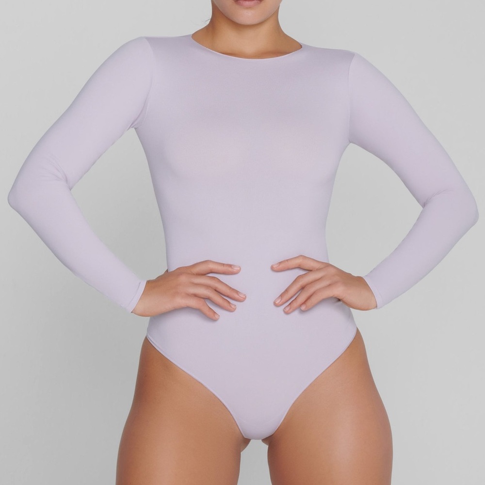 SKIMS Essential Crew Neck Long Sleeve Bodysuit —- Color: Iris Mica